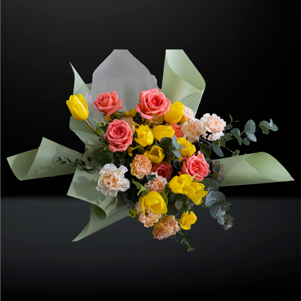 bouquet, hand bouquet, flower bouquet, bloom with love, gift with love, flowers for mum, birthday flowers, anniversary flowers, Yellow Tulips, Salmon Roses, Cream Carnations, Champagne Eustomas and Mixed Eucalyptus 